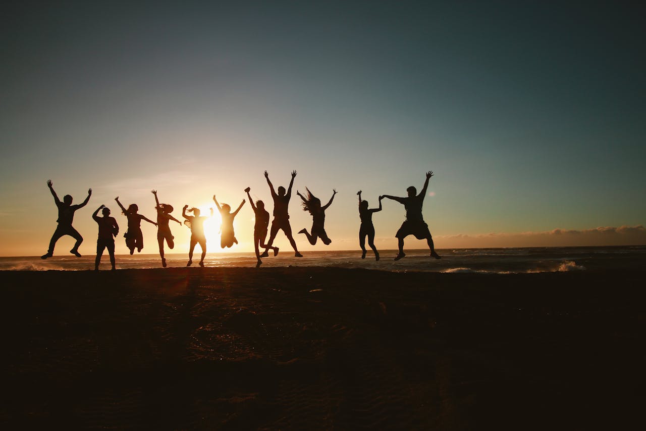 Over Ons Silhouette Photography Of Group Of People Jumping During Golden Time 1000445